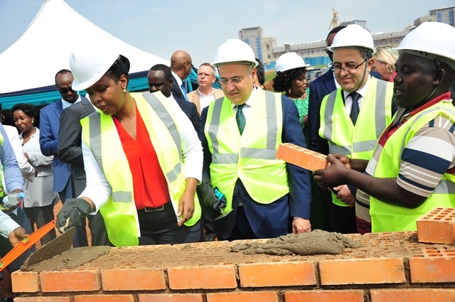 Rwanda Development CEO, Clare Akamanzi lays the cornerstone as Cooper Pharma CEO, Ayman Cheikh Lahlou and Moroccan Ambassador to Rwanda, Youssef Imani watch