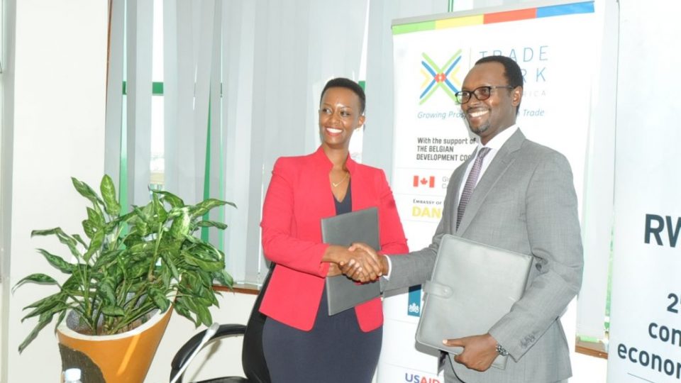 RDB Deputy Chief Executive Officer and Chief Operating Officer Emmanuel Hategeka and TMEA Country Director Patience Mutesi Gatera shaking hands after the signing partnership agreement