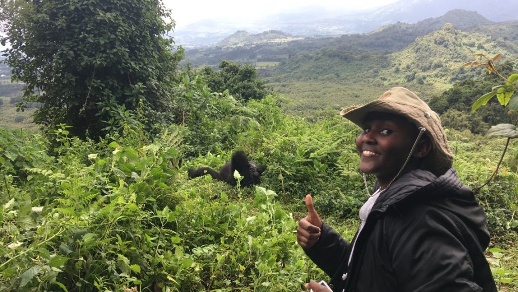 Ishimwe Gasana Ritha, one of the winners of Temberurwanda15 competition with the endangered mountain gorillas in Volcanoes National Park-Rwanda
