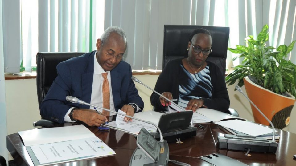 Chairman of the DPFZA Omar Hadi Aboubaker (L) and the Managing Director of PEZ Jeanne Isabelle Gasana (R) sign the MoU for the development of the 10-hectare land t