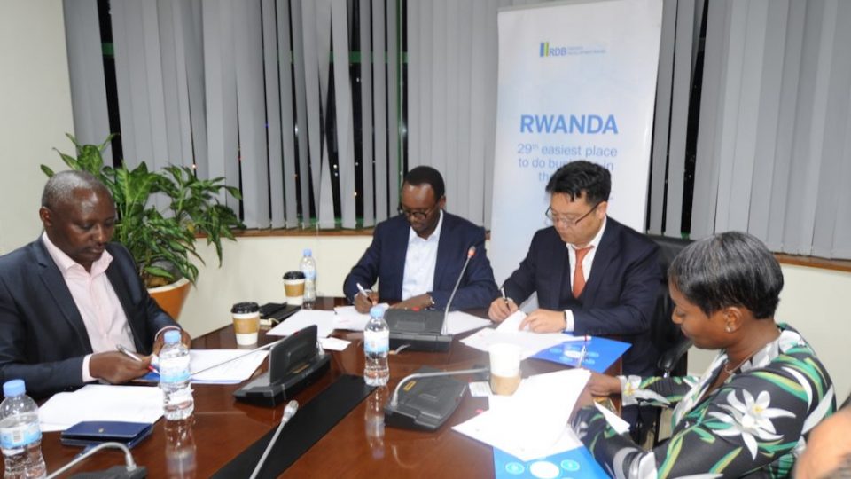 From L-R, KESI Rwanda Executive Chairman, Robert Bapfakulera, RDB’s Deputy CEO, Emmanuel Hategeka and Pink Mango C&D’s Director, Gordon Gu sign the agreements