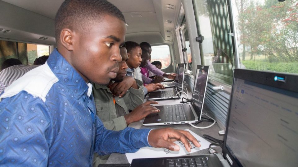 Some of the 200 youth register on RDB’s online job portal, kora.rw in the mobile employment service bus in Musanze today