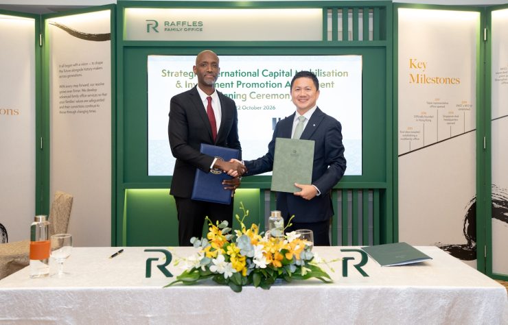 Chi Man Kwan, Group Chief Executive Officer of Raffles Family Office, and Jean-Guy Afrika, Chief Executive Officer of the Rwanda Development Board, at the RFO Annual Forum in Singapore.